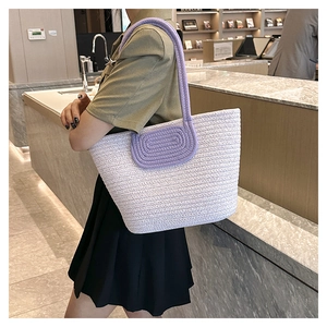 Close-up of woven lavender and beige tote bag with purple rope strap detail