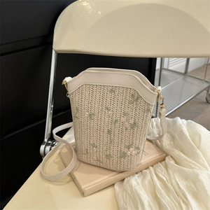 French style woven bucket bag with floral embroidery and creamy white leather strap