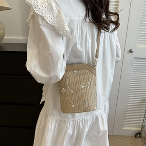 Fashionable straw bucket bag with floral embroidery and khaki leather shoulder strap