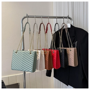 Detailed display of six quilted chain shoulder bags in various colors on hangers