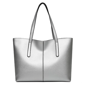 Metallic silver faux leather tote bag with a spacious trapezoid design for daily commuting