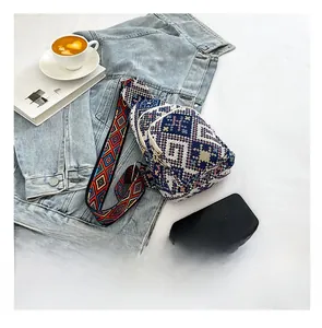 Size comparison of bohemian crossbody bag with colorful strap and blue denim jacket