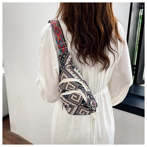 Rear view of ethnic woven crossbody bag with geometric patterns and jacquard strap