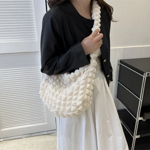 White puffy cloud shoulder bag with textured popcorn fabric and minimalist design
