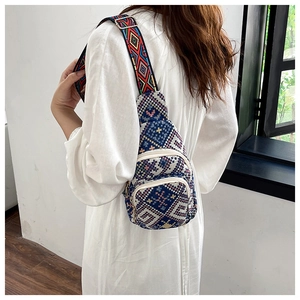Detailed view of the bohemian crossbody bag featuring ethnic geometric embroidery and wide strap