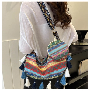 Close-up of ethnic woven tote bag set with colorful fringe and matching small round pouch