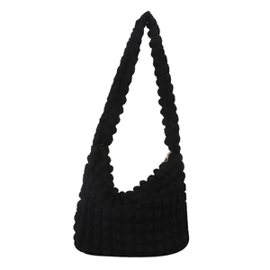 Black cloud shoulder bag with textured bubble design and golden zipper closure for women
