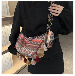 Ethnic bohemian moon bag with colorful tassels and matching coin purse on a model