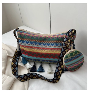 Detail view of ethnic boho tote bag with geometric patterns and tri-color tassels