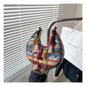 Bohemian crescent bag with colorful ethnic patterns, fringe tassels and golden chain strap