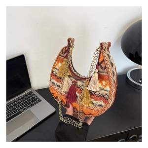 Ethnic crescent crossbody bag with embroidery patterns, colorful tassels and chain strap