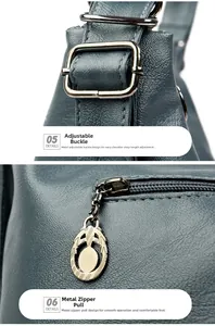 Detail view of silver metal buckles and decorative zipper pulls on a grey PU leather backpack