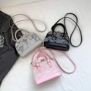 Chic shell-shaped tote bags in black, grey, and pink with embroidery and gold studs
