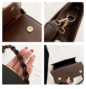 Detail view of brown PU leather crossbody bag featuring magnetic buckles and braided handle