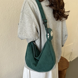 Japanese style green corduroy crescent crossbody bag with small round coin purse charm