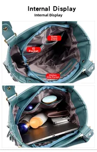 Internal view of women's teal handbag showing compartments and large storage capacity