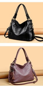 Detail view of large tote bags in black and purple with tassel and pebble texture