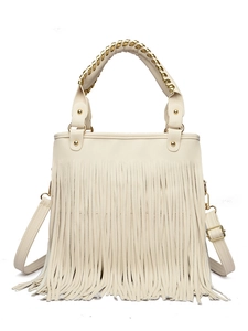 Detailed view of bohemian beige handbag with long fringe and braided gold metal handles