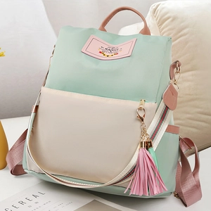 Sac à dos chic en nylon vert menthe et beige avec bretelles rayées et détail gland