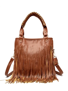 Close-up of brown PU leather handbag featuring long fringes and woven handles