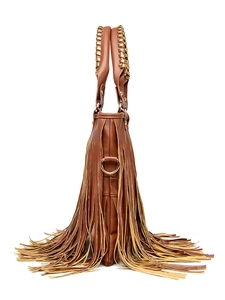 Detail view of brown PU leather bag featuring bohemian tassels and metal chain handles