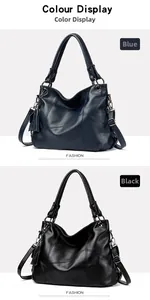 Detail view of large PU leather tote bags in blue and black with tassel charm and soft texture