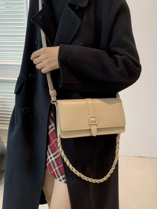 Classic beige rectangle flap crossbody bag with woven chain and square buckle detail