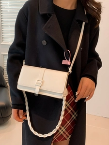 Classic white flap shoulder bag with woven strap and decorative buckle for women