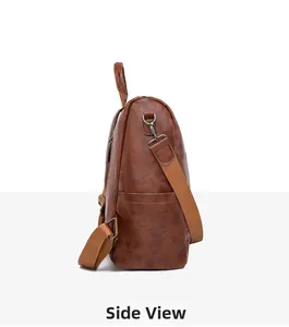 Side view of vintage brown leather backpack showing adjustable straps and pocket