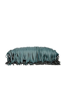 Close-up of deep green pebbled leather handbag featuring dense fringe details