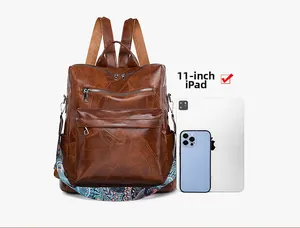 Brown vintage backpack detail showing 11-inch iPad storage capacity and woven strap