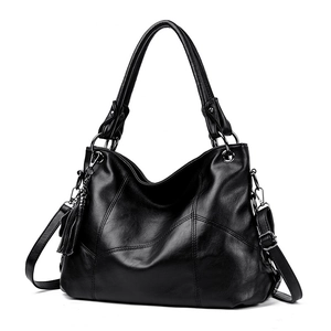 Black pebbled PU leather tote bag with tassel charm and adjustable shoulder strap