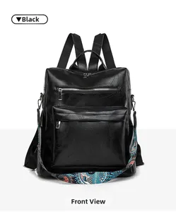 Close-up of black PU leather backpack with cross-embossed texture and boho print strap