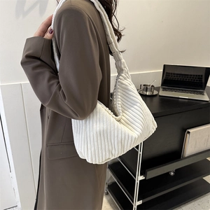 Fashionable cream corduroy tote bag for women showing a minimalist shoulder bag design