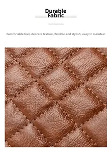 Détail du tissu matelassé marron avec texture grainée et coutures renforcées durables