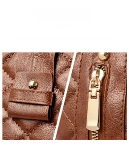 Détails de la sacoche en cuir marron avec matelassage et ferrures en métal doré brillant