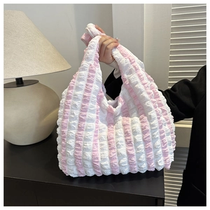 Close-up of pink and white pleated bubble tote bag with soft ruffled texture