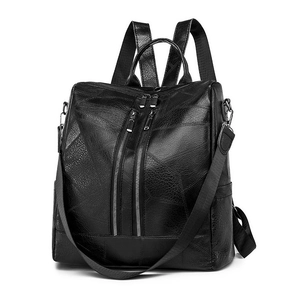 Women's minimalist anti-theft backpack in black litchi pattern leather with silver zippers