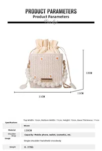 Detailed view of woven straw bucket bag with daisy embroidery and pearl handle strap