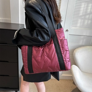 Plum red quilted puffer tote bag with large capacity and soft padding for autumn winter
