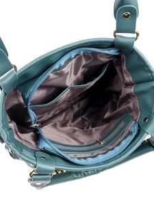 Interior view of dark teal handbag featuring a main compartment and functional pockets