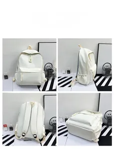 Detail view of white minimalist nylon backpack featuring large front pocket and side pockets