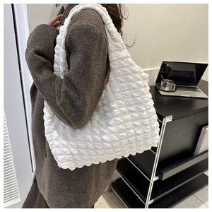 Close-up of white bubble texture tote bag showing 3D fabric detail for women