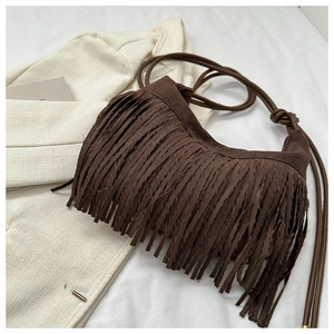Detailed view of a dark brown suede tassel shoulder bag with a stylish long fringe design