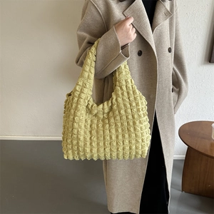 Yellow popcorn fabric tote bag with ruched texture and minimalist French style shoulder strap