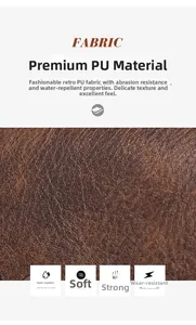 Detail showing waterproof and soft brown PU leather texture with lychee pattern on backpack