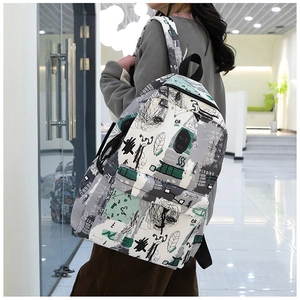 Side view of Japanese graffiti backpack with artistic prints and canvas texture