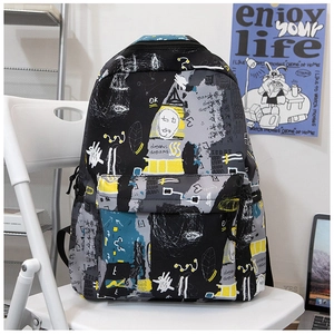 Detail of street graffiti backpack with artistic prints and front zipper pocket