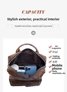 Interior view of soft brown leather backpack showing compartments for phone and power bank