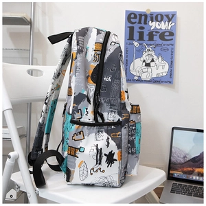Detailed side view of street graffiti backpack with pockets and durable straps